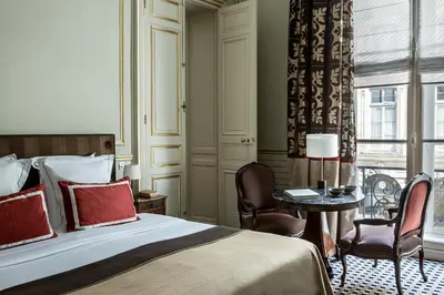 Un ou plusieurs lits dans un hébergement de l'établissement Hôtel Mansart - Esprit de France