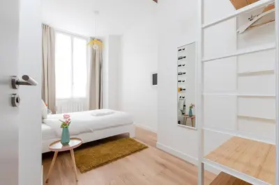 Un ou plusieurs lits dans un hébergement de l'établissement Appartement Vertus