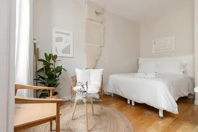 Un ou plusieurs lits dans un hébergement de l'établissement Appartement Vertus