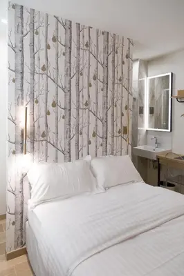Un ou plusieurs lits dans un hébergement de l'établissement Hôtel So Marais