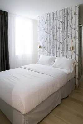 Un ou plusieurs lits dans un hébergement de l'établissement Hôtel So Marais