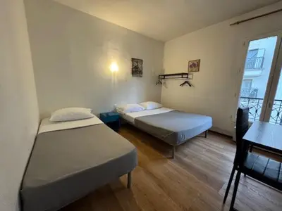 Un ou plusieurs lits dans un hébergement de l'établissement Hotel Chevallier