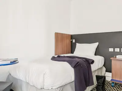 Un ou plusieurs lits dans un hébergement de l'établissement ibis Styles Paris République Le Marais