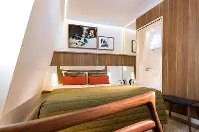 Un ou plusieurs lits dans un hébergement de l'établissement Hôtel Eiffel Turenne