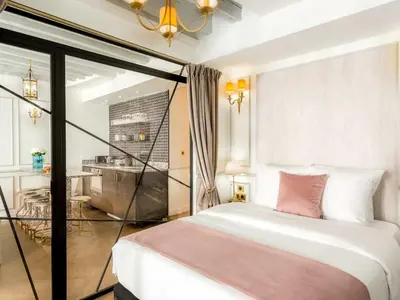 Un ou plusieurs lits dans un hébergement de l'établissement Merveil - Luxury Suite - Louvre - Rambuteau