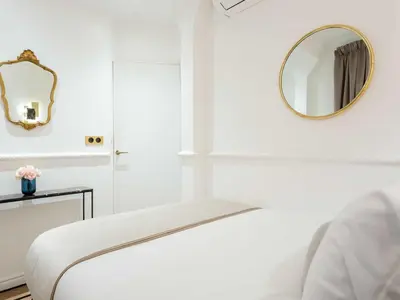 Un ou plusieurs lits dans un hébergement de l'établissement Merveil - Luxury Suite - Louvre - Rambuteau