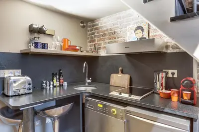 Cuisine ou kitchenette dans l'établissement Appartement, Place Vendome