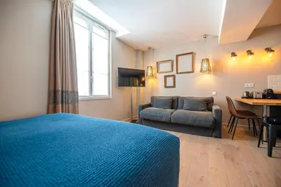 Télévision ou salle de divertissement dans l'établissement Residence Les Boulevards