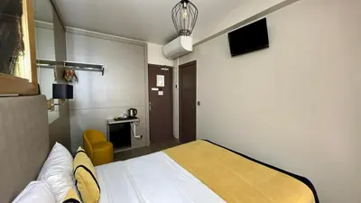 Télévision ou salle de divertissement dans l'établissement Pratic Hotel