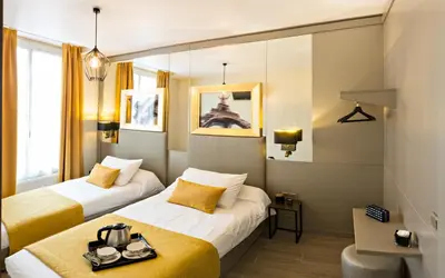 Un ou plusieurs lits dans un hébergement de l'établissement Pratic Hotel