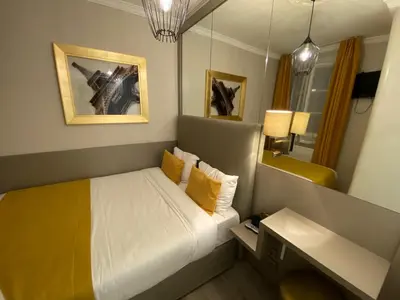 Un ou plusieurs lits dans un hébergement de l'établissement Pratic Hotel