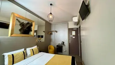 Télévision ou salle de divertissement dans l'établissement Pratic Hotel