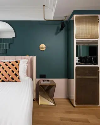 Un ou plusieurs lits dans un hébergement de l'établissement Hôtel Parisianer