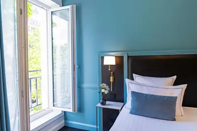 Un ou plusieurs lits dans un hébergement de l'établissement Hôtel Le Cercle Tour Eiffel