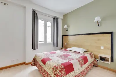 Un ou plusieurs lits dans un hébergement de l'établissement Hotel de l'Europe