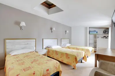 Un ou plusieurs lits dans un hébergement de l'établissement Hotel de l'Europe