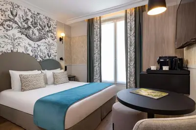 Un ou plusieurs lits dans un hébergement de l'établissement Grand Hôtel Lévêque