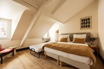 Un ou plusieurs lits dans un hébergement de l'établissement Maison Gaîté