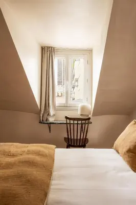Un ou plusieurs lits dans un hébergement de l'établissement Maison Gaîté