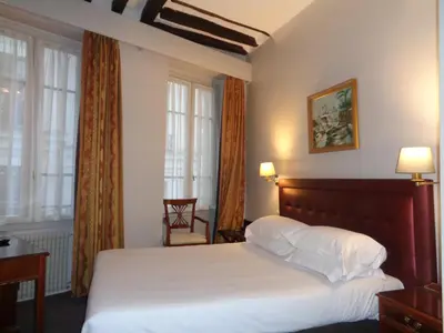 Un ou plusieurs lits dans un hébergement de l'établissement Hôtel les Degrés de Notre Dame
