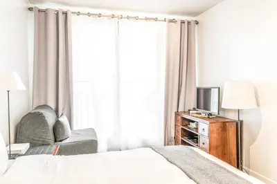 Un ou plusieurs lits dans un hébergement de l'établissement Champs Elysees Flat