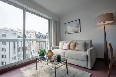 Coin salon dans l'établissement Appt calme sur cour- Montparnasse - Necker