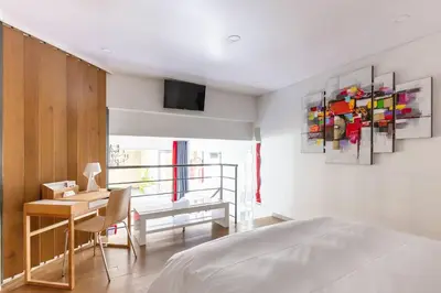 Un ou plusieurs lits dans un hébergement de l'établissement Home in Paris Marais Elegant Flat in Old Paris