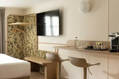 Un ou plusieurs lits dans un hébergement de l'établissement Hotel d'Espagne