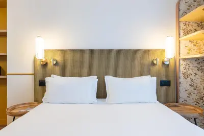 Un ou plusieurs lits dans un hébergement de l'établissement Hotel d'Espagne