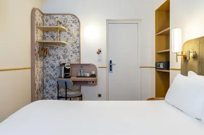 Un ou plusieurs lits dans un hébergement de l'établissement Hotel d'Espagne