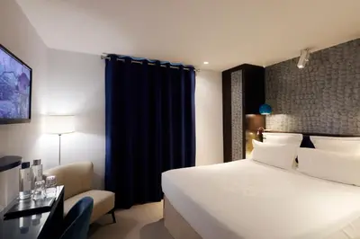 Un ou plusieurs lits dans un hébergement de l'établissement Hotel Eden