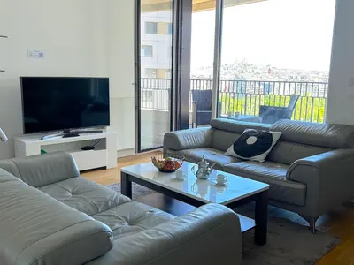 Coin salon dans l'établissement L'appartement Rostro