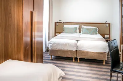 Un ou plusieurs lits dans un hébergement de l'établissement Art Hotel Eiffel