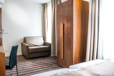 Un ou plusieurs lits dans un hébergement de l'établissement Art Hotel Eiffel