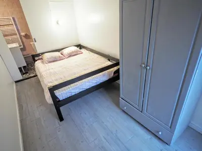Un ou plusieurs lits dans un hébergement de l'établissement Appartement JARDINS DU LOUVRE