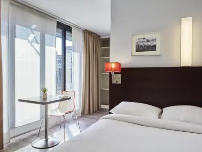 Un ou plusieurs lits dans un hébergement de l'établissement Aparthotel Adagio Access Paris Bastille