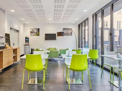 Télévision ou salle de divertissement dans l'établissement Aparthotel Adagio Access Paris Bastille