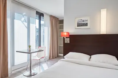 Un ou plusieurs lits dans un hébergement de l'établissement Aparthotel Adagio Access Paris Bastille