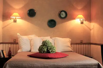 Un ou plusieurs lits dans un hébergement de l'établissement Hôtel Relais Monceau