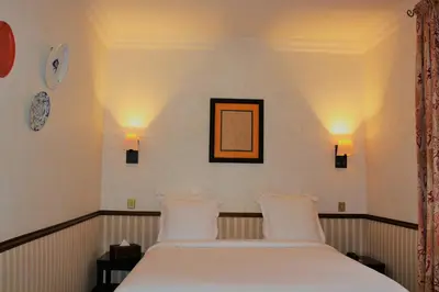 Un ou plusieurs lits dans un hébergement de l'établissement Hôtel Relais Monceau
