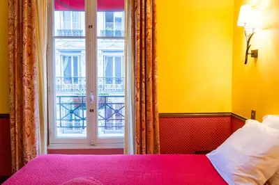 Un ou plusieurs lits dans un hébergement de l'établissement Hôtel Relais Monceau