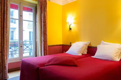 Un ou plusieurs lits dans un hébergement de l'établissement Hôtel Relais Monceau