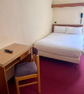 Un ou plusieurs lits dans un hébergement de l'établissement Hotel Paris Bercy