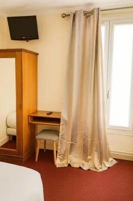 Un ou plusieurs lits dans un hébergement de l'établissement Hotel Paris Bercy
