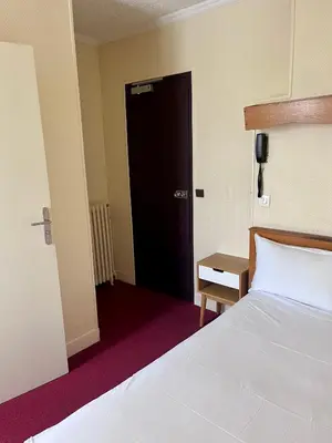 Un ou plusieurs lits dans un hébergement de l'établissement Hotel Paris Bercy