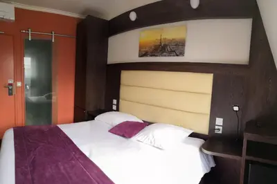 Un ou plusieurs lits dans un hébergement de l'établissement Parc Hotel