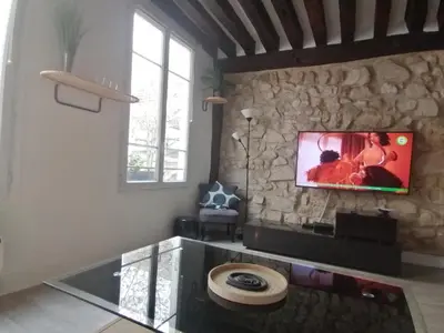 Télévision ou salle de divertissement dans l'établissement Appartement St Martin