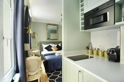 Cuisine ou kitchenette dans l'établissement Studio Opéra by Studio prestige