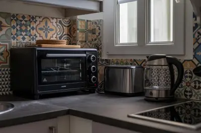 Cuisine ou kitchenette dans l'établissement Charmant 2 pièces pour 4 personnes à Courbevoie