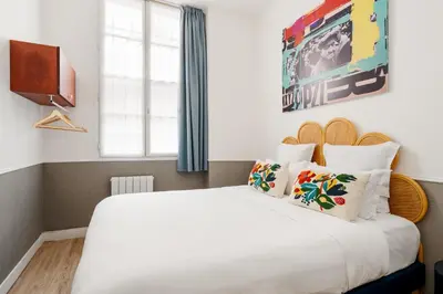 Un ou plusieurs lits dans un hébergement de l'établissement Edgar Suites Saint-Augustin - Naples